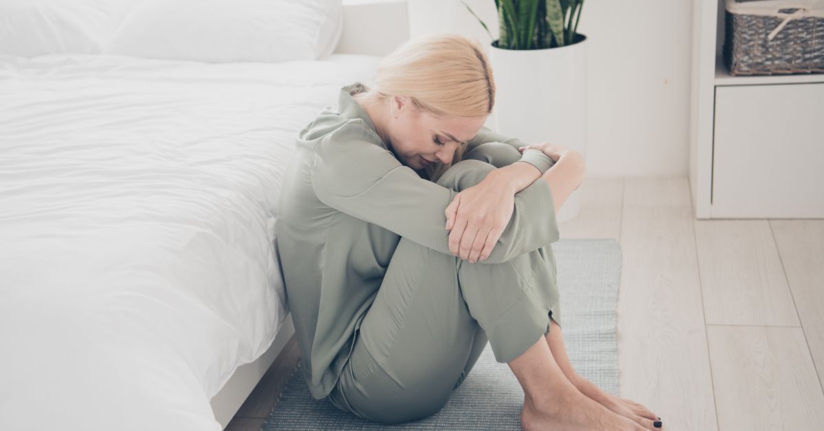 Woman showing fatigue while experiencing side effects of semaglutide treatment.